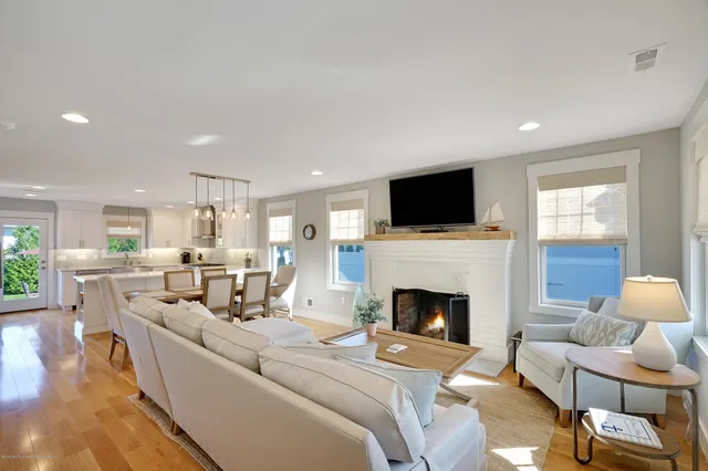 a living room with furniture fireplace and flat screen tv