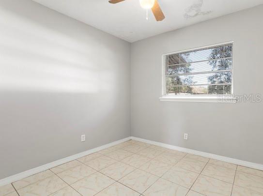 5614 Riviera Drive Orlando, FL 32808 - Photo 11 of 17 an empty room with windows