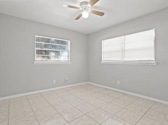 5614 Riviera Drive Orlando, FL 32808 - Photo 12 of 17 a view of an empty room with a window
