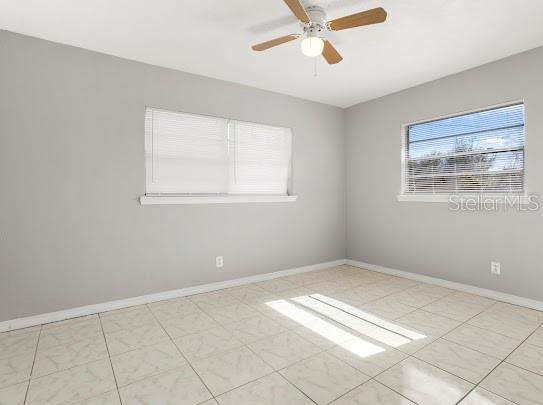 5614 Riviera Drive Orlando, FL 32808 - Photo 14 of 17 a view of an empty room with a window