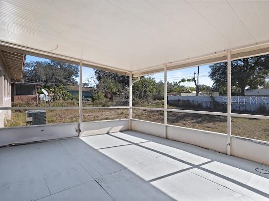 5614 Riviera Drive Orlando, FL 32808 - Photo 16 of 17 a view of empty room with floor to ceiling windows