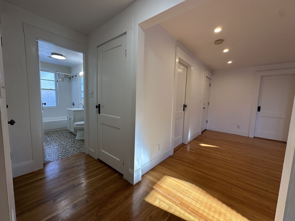 76 Wenham Street, Unit 3 Boston, MA 02130 - Photo 12 of 23 a view of empty room with wooden floor