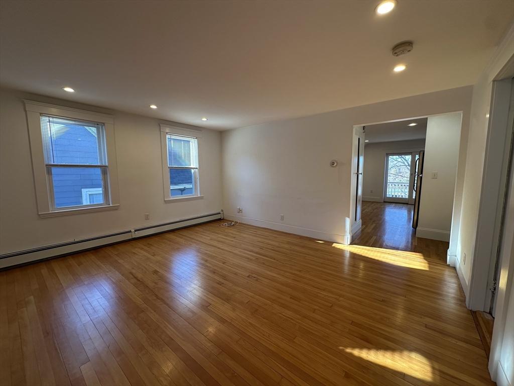 76 Wenham Street, Unit 3 Boston, MA 02130 - Photo 17 of 23 a view of empty room with wooden floor and fan