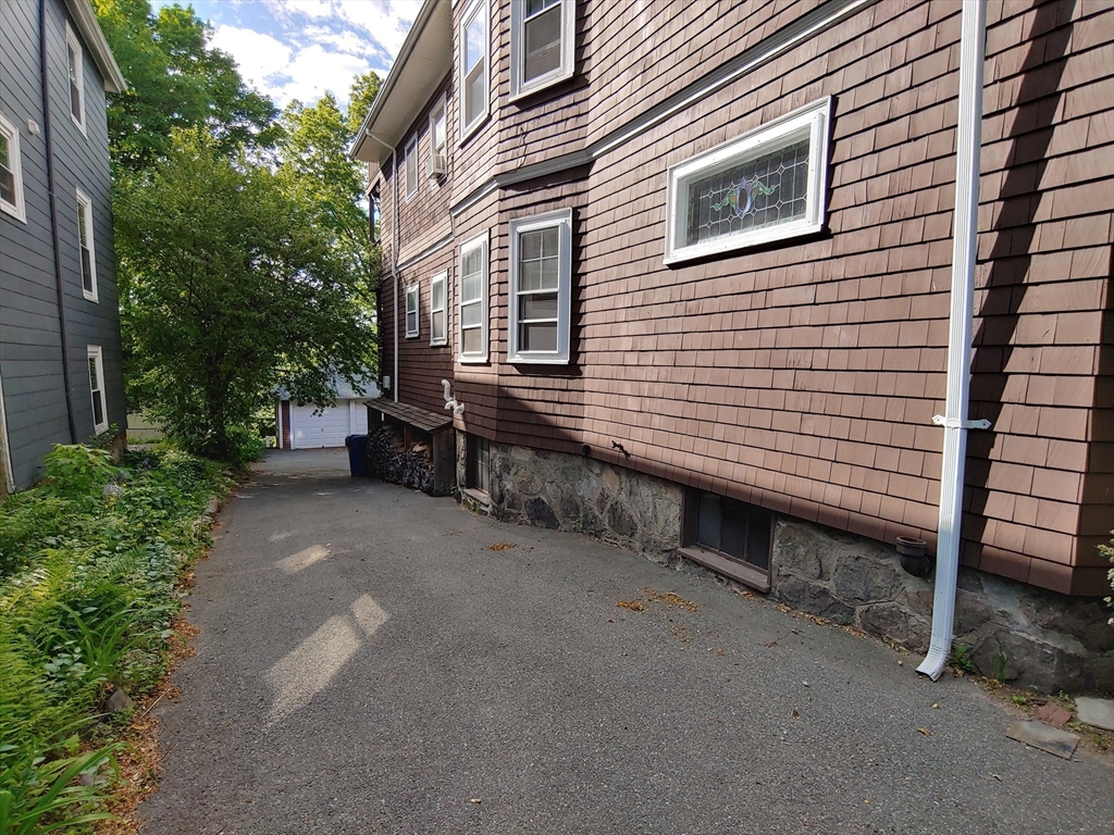 76 Wenham Street, Unit 3 Boston, MA 02130 - Photo 21 of 23 a view of a house with a yard and sitting area