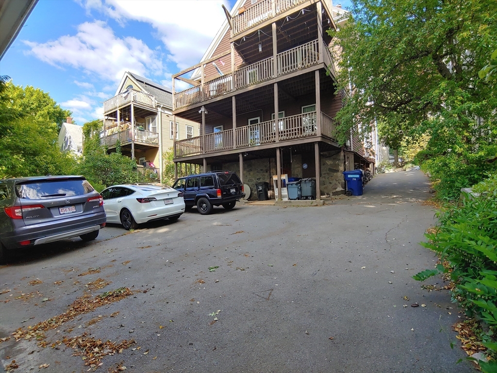 76 Wenham Street, Unit 3 Boston, MA 02130 - Photo 22 of 23 a car parked in front of a building