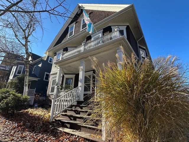 front view of a house with a small yard