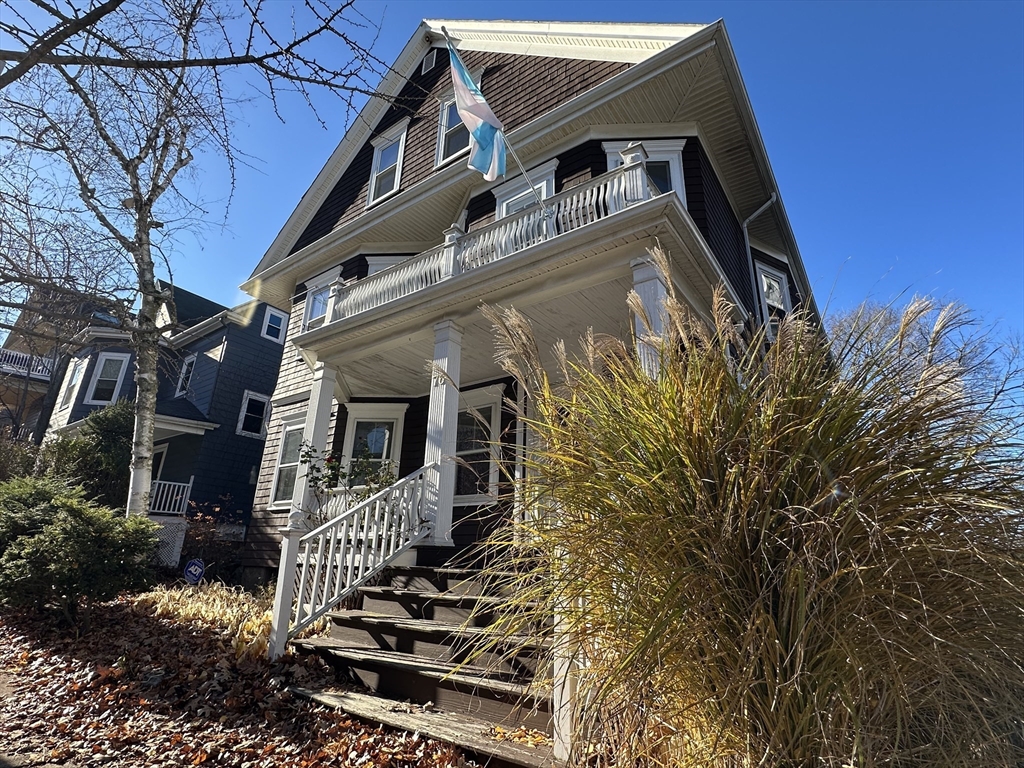 76 Wenham Street, Unit 3 Boston, MA 02130 - Photo 23 of 23 front view of a house with a small yard