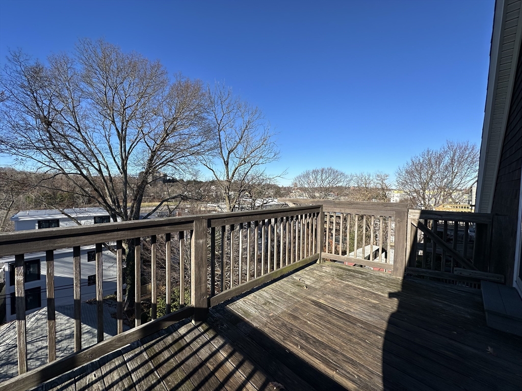 76 Wenham Street, Unit 3 Boston, MA 02130 - Photo 6 of 23 a view of wooden deck and a backyard
