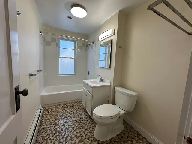 a bathroom with a toilet a sink and a bathtub