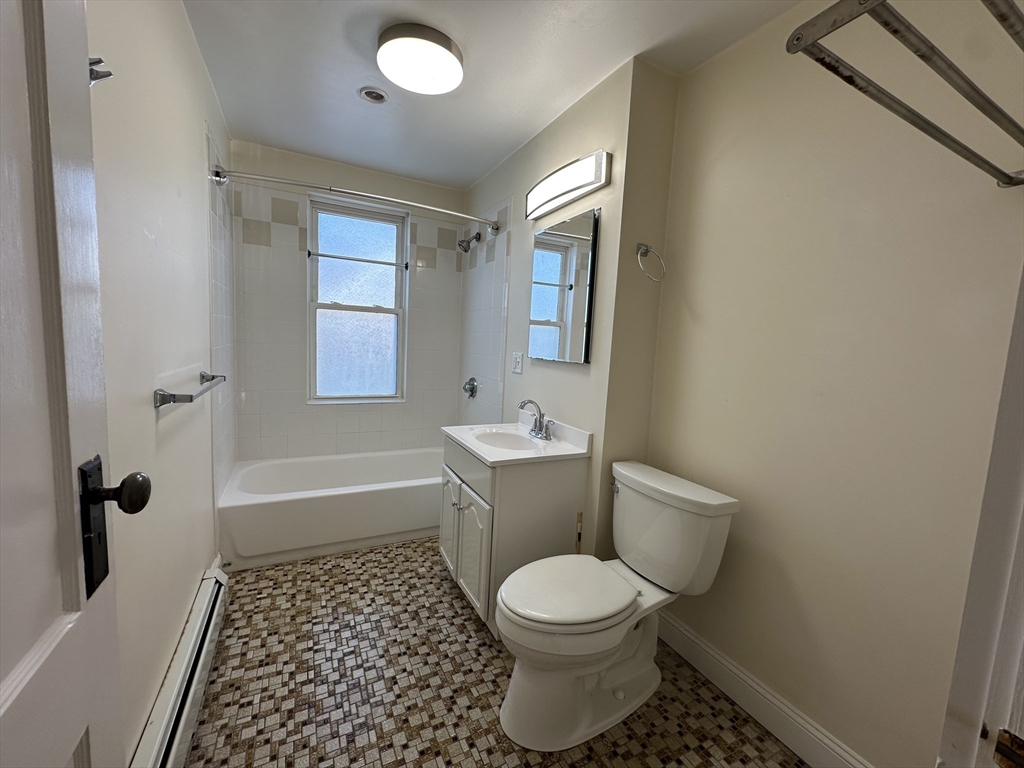 76 Wenham Street, Unit 3 Boston, MA 02130 - Photo 10 of 23 a bathroom with a toilet a sink and a bathtub