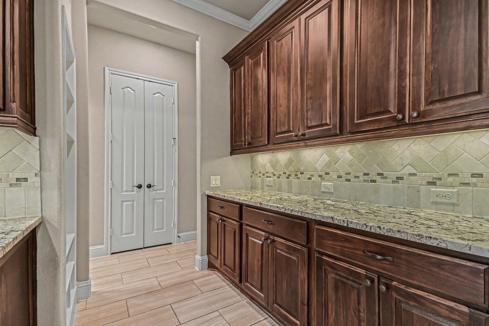 3310 Ralston Edge Lane Houston, TX 77059 - Photo 18 of 50 a view of kitchen with granite countertop wooden cabinets