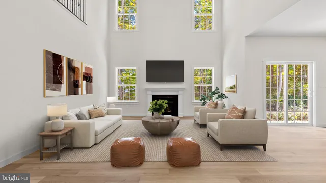 a view of an empty room with window and fireplace