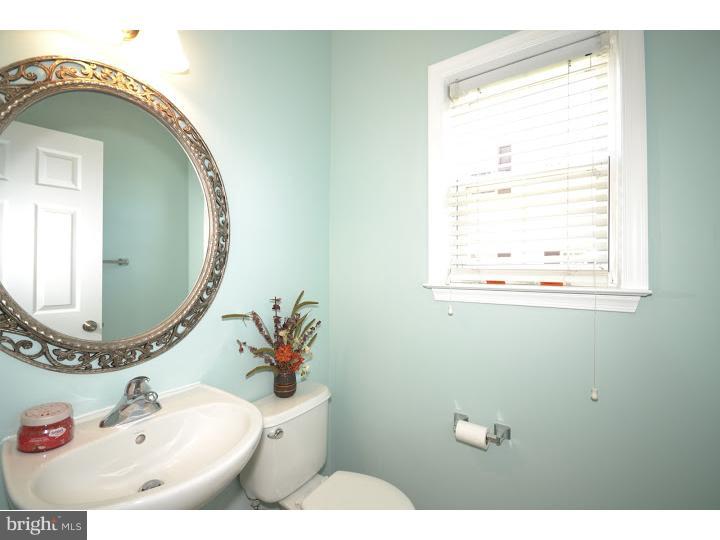 487 Buchanan Road Perkasie, PA 18944 - Photo 15 of 25 a bathroom with a toilet and a mirror