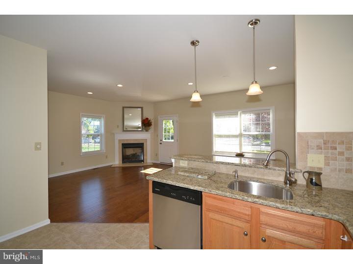 487 Buchanan Road Perkasie, PA 18944 - Photo 3 of 25 a kitchen with granite countertop a sink window and cabinets