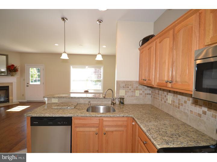 487 Buchanan Road Perkasie, PA 18944 - Photo 4 of 25 a kitchen with granite countertop a sink a counter top space cabinets and stainless steel appliances