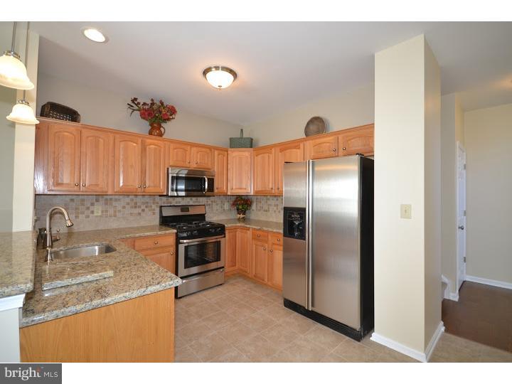 487 Buchanan Road Perkasie, PA 18944 - Photo 6 of 25 a kitchen with stainless steel appliances granite countertop a refrigerator sink and stove