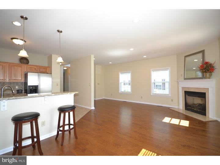 487 Buchanan Road Perkasie, PA 18944 - Photo 8 of 25 a kitchen with kitchen island a dining table chairs stainless steel appliances and cabinets