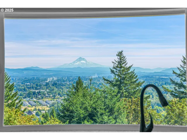 a kitchen with a large window sink and cabinets