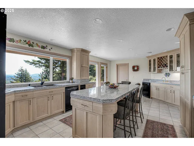 a living room with furniture and view of kitchen
