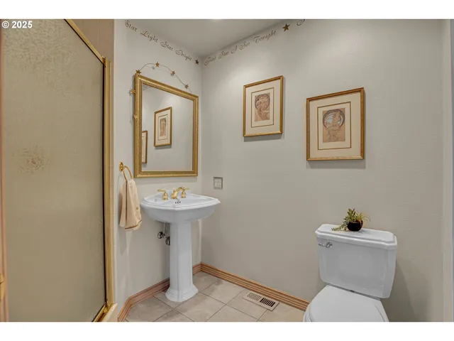 a utility room with cabinets washer and dryer