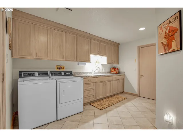 a bedroom with furniture and a large window