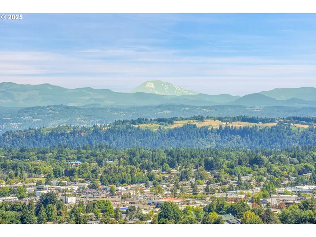 a bedroom with furniture and a large window