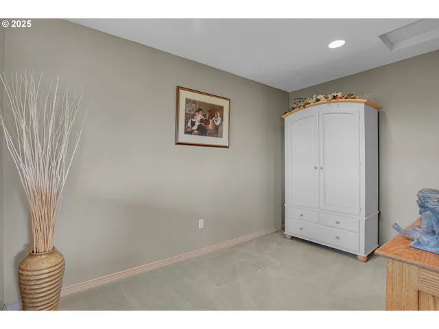 a bathroom with a tub a sink and a large mirror