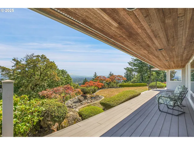 a balcony with a table and chairs
