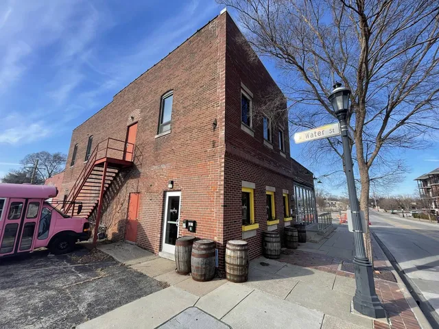 a view of a patio with a table and chairs