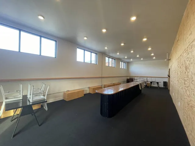 a room with wooden cabinets and outdoor seating