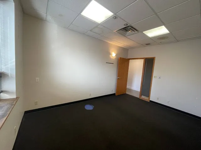 an empty room with a empty space and a window