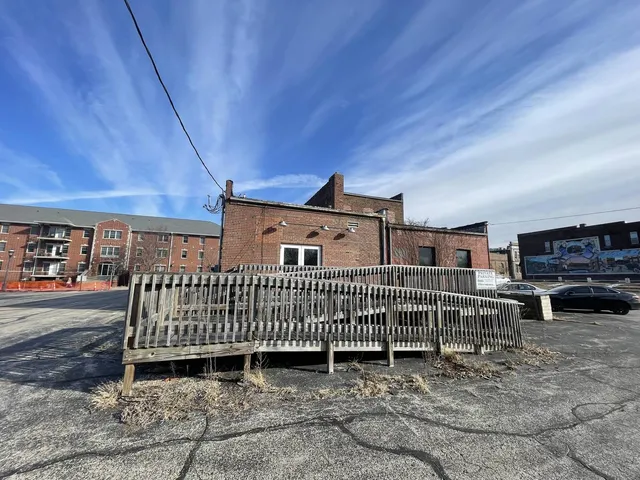 a view of a porch with wooden fence