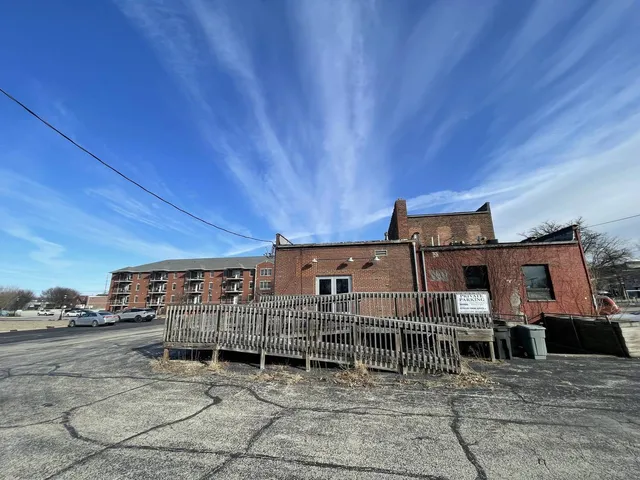 a front view of a house with barbeque oven