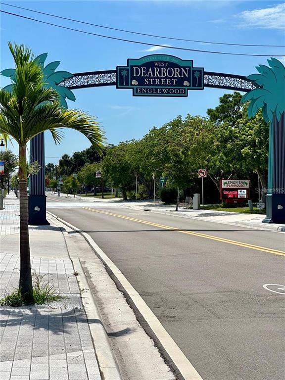 1695 Manor Road Englewood, FL 34223 - Photo 29 of 37 a view of street with parking and sign board