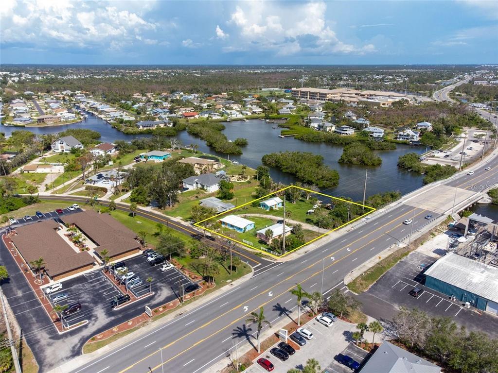 1695 Manor Road Englewood, FL 34223 - Photo 5 of 37 an aerial view of residential houses with outdoor space
