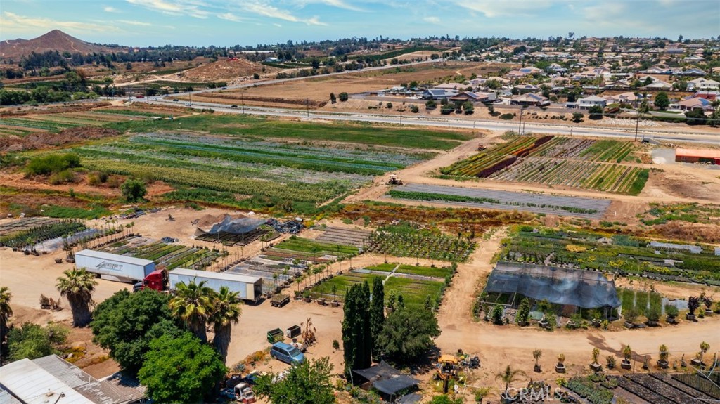 19203 Cajalco Road Perris, CA 92570 - Photo 5 of 14 an aerial view of residential houses with outdoor space
