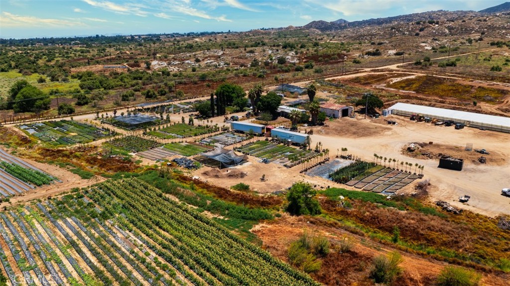 19203 Cajalco Road Perris, CA 92570 - Photo 10 of 14 an aerial view of residential houses with outdoor space
