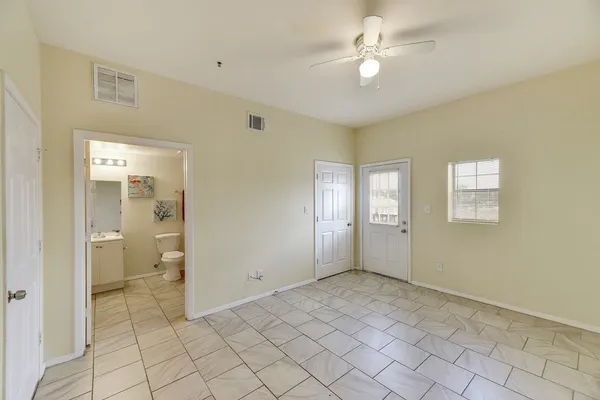 a bathroom with a toilet a sink and a shower