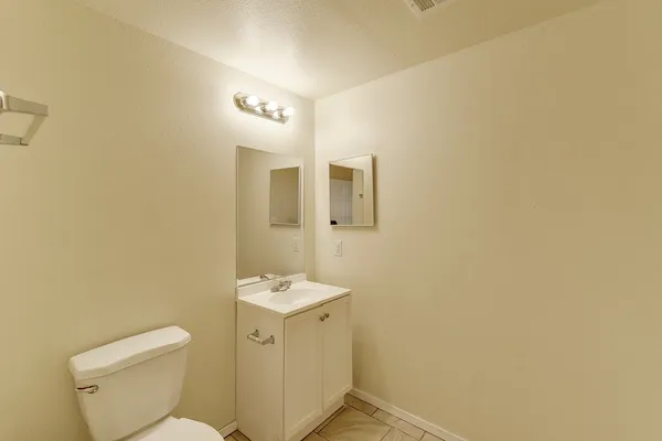 a front view of a building with parking space