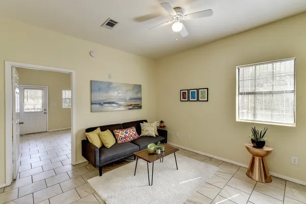 a living room with furniture and a window