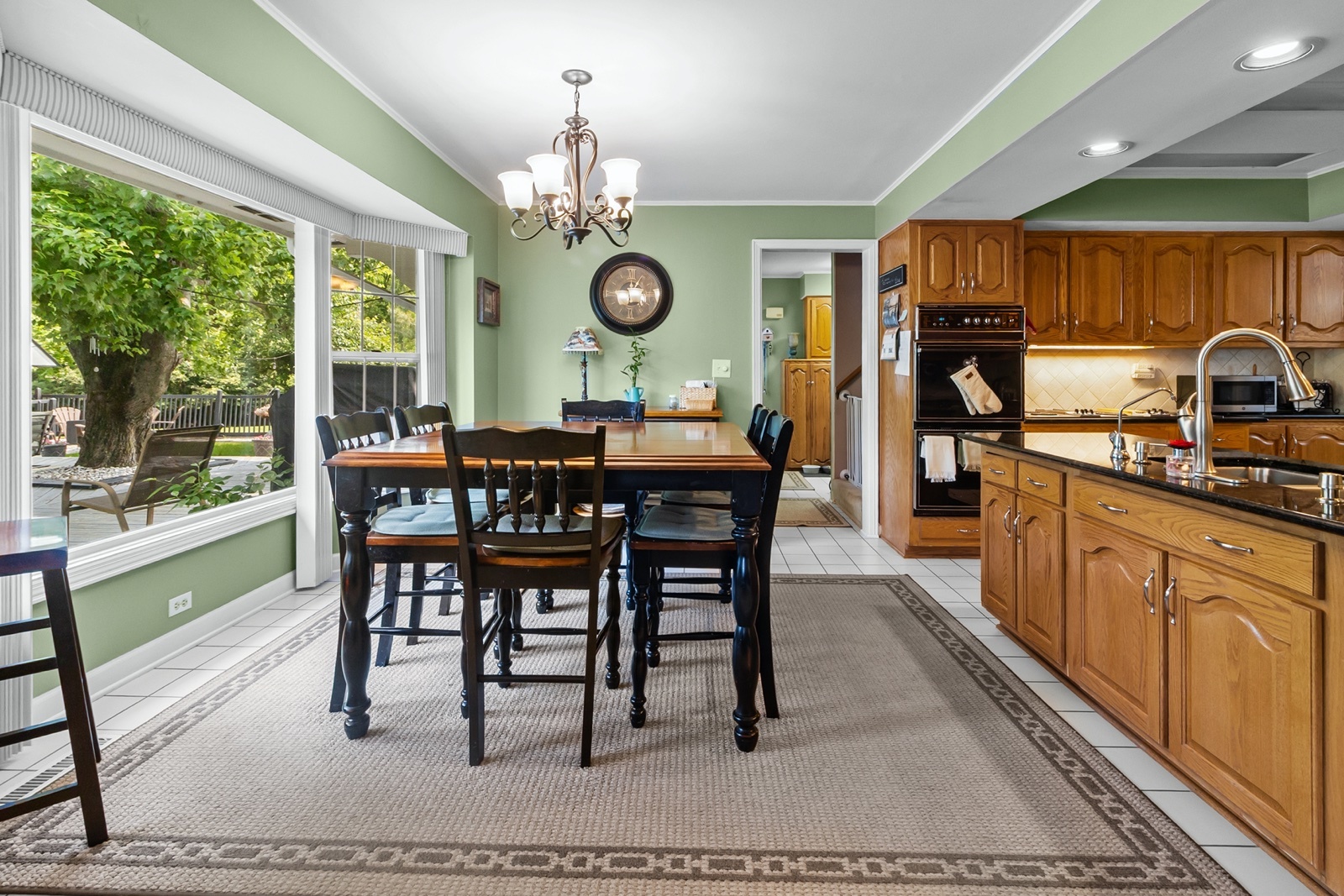 8612 Crystal Springs Road Woodstock, IL 60098 - Photo 11 of 45 a view of a dining room with furniture window and outside view
