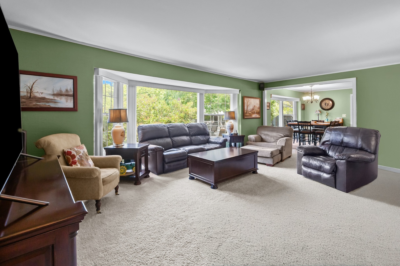 8612 Crystal Springs Road Woodstock, IL 60098 - Photo 15 of 45 a living room with furniture and a large window