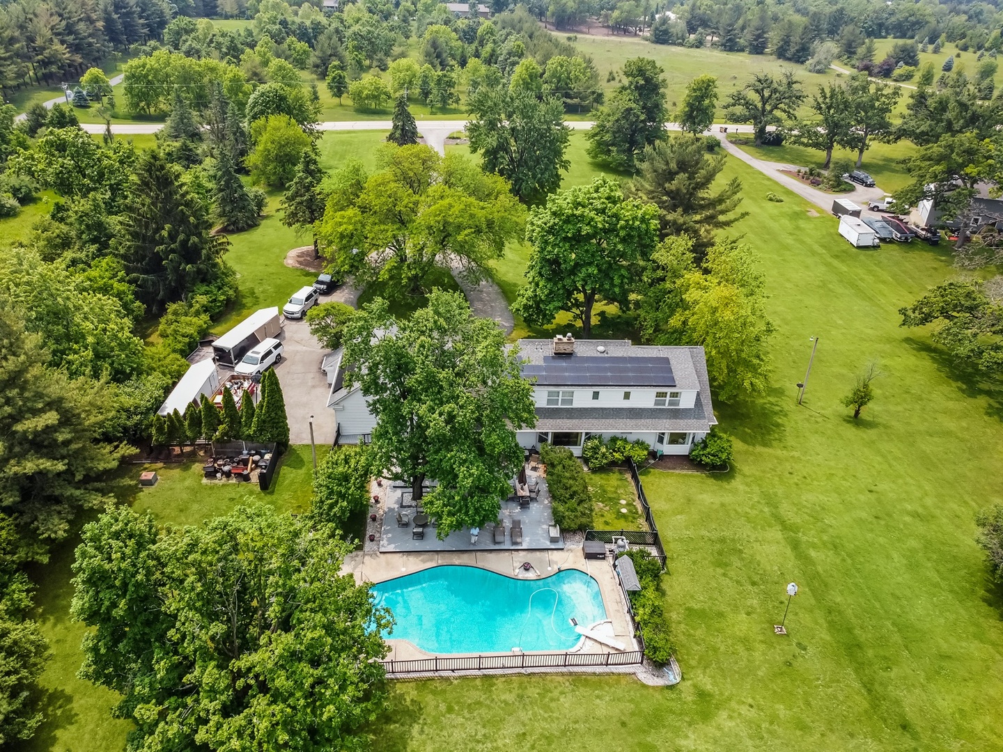 8612 Crystal Springs Road Woodstock, IL 60098 - Photo 42 of 45 an aerial view of residential house with outdoor space and swimming pool