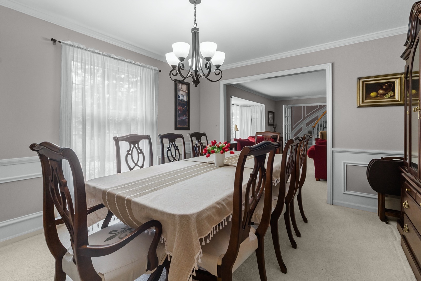 8612 Crystal Springs Road Woodstock, IL 60098 - Photo 8 of 45 a view of a dining room with furniture and chandelier