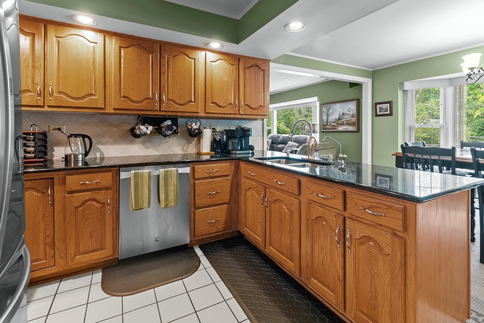 8612 Crystal Springs Road Woodstock, IL 60098 - Photo 10 of 45 a kitchen with stainless steel appliances granite countertop a sink and cabinets