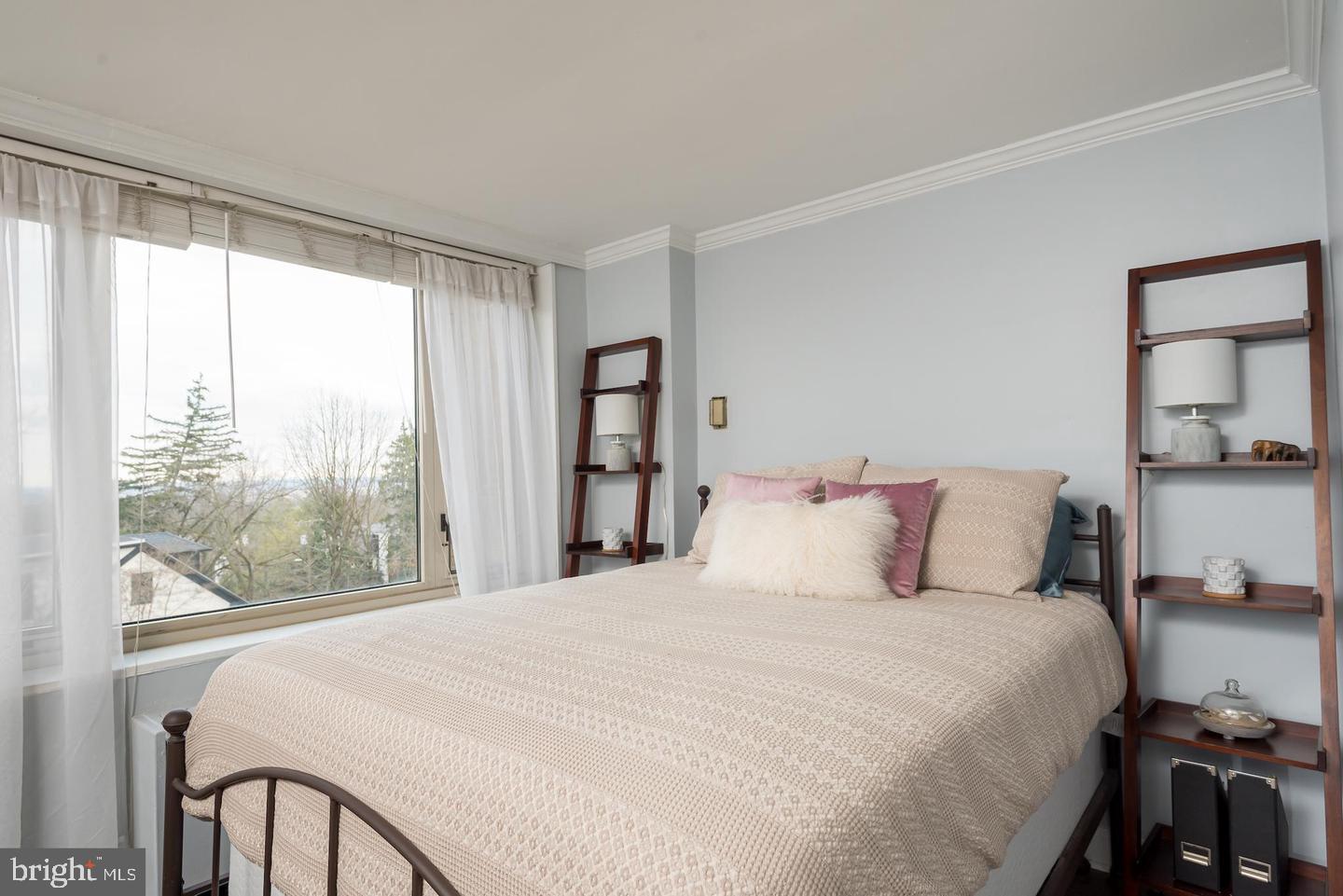 2800 Wisconsin Avenue Northwest, Unit 510 Washington, DC 20007 - Photo 13 of 20 a large bed sitting in a bedroom next to a window