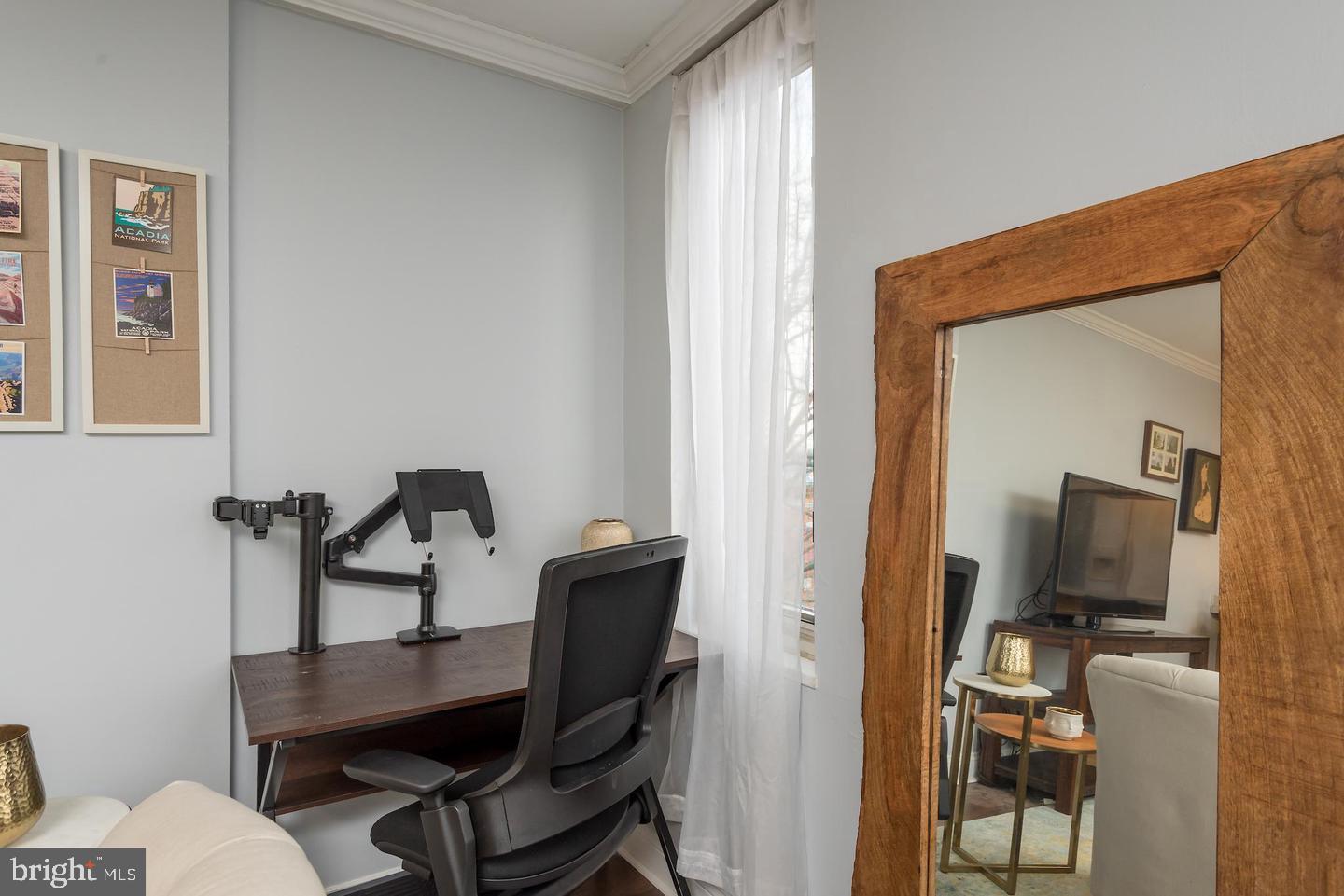 2800 Wisconsin Avenue Northwest, Unit 510 Washington, DC 20007 - Photo 15 of 20 a view of a workspace with furniture and a window