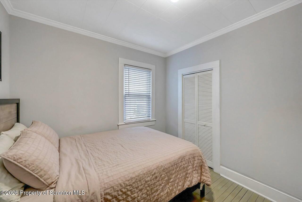 641 East Elm Street Scranton, PA 18505 - Photo 18 of 59 a bedroom with a bed and a window