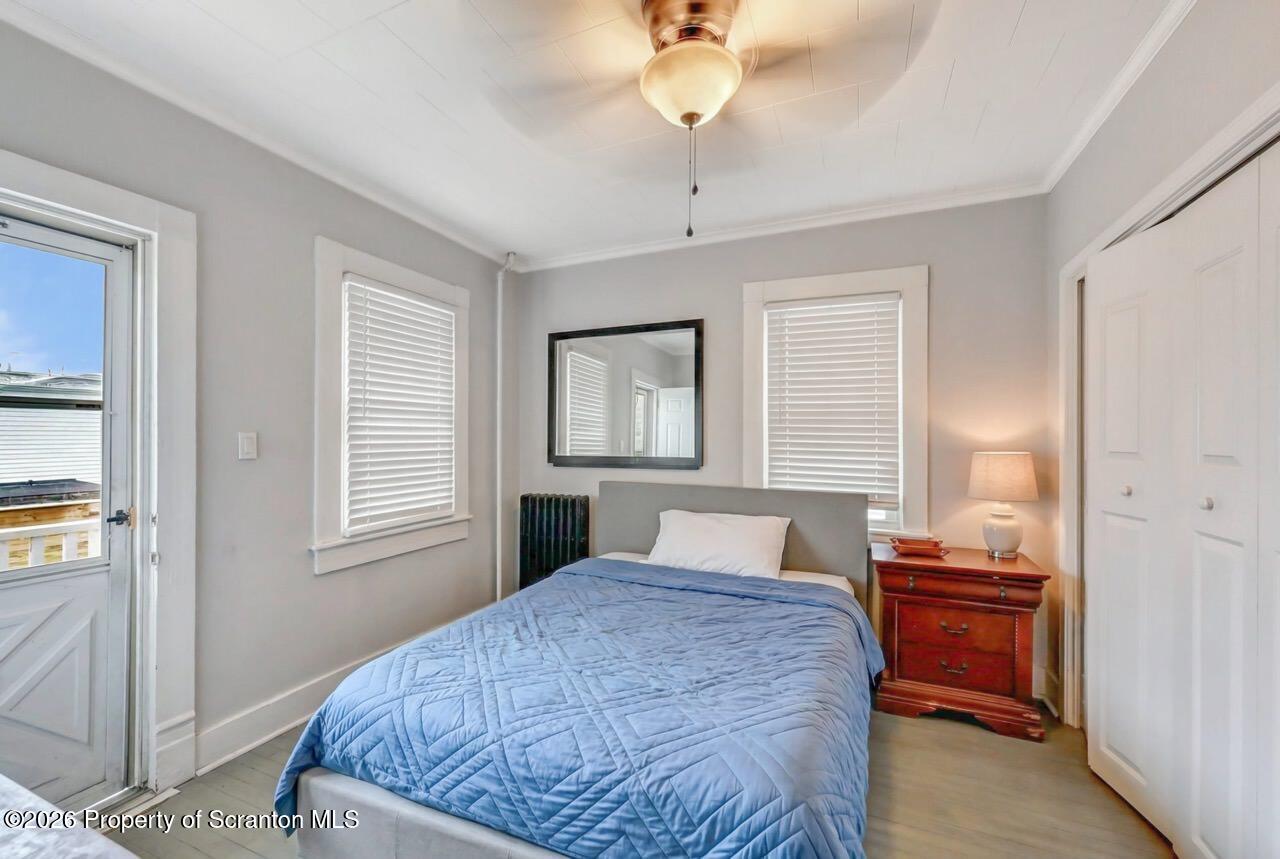 641 East Elm Street Scranton, PA 18505 - Photo 24 of 59 a bedroom with a large bed and a window