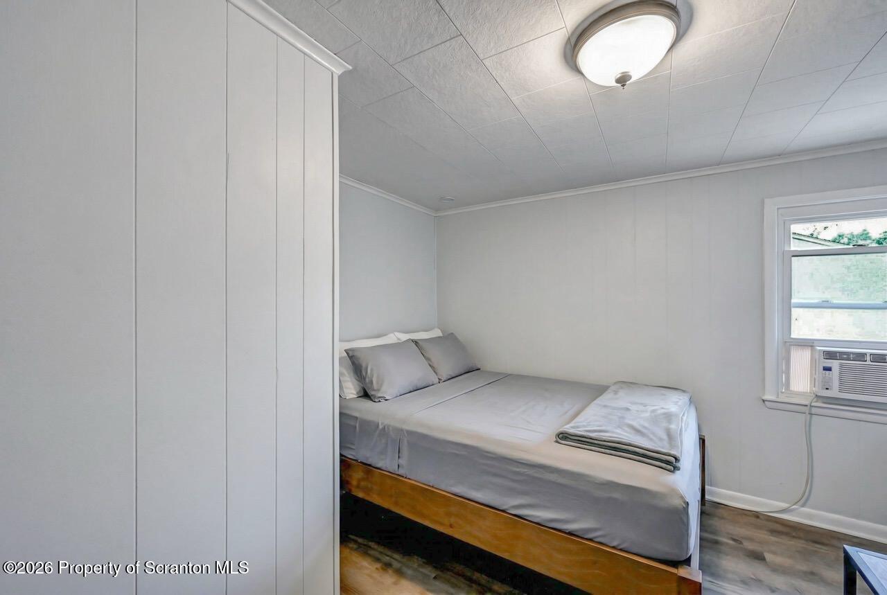 641 East Elm Street Scranton, PA 18505 - Photo 39 of 59 a bedroom with a bed and a window
